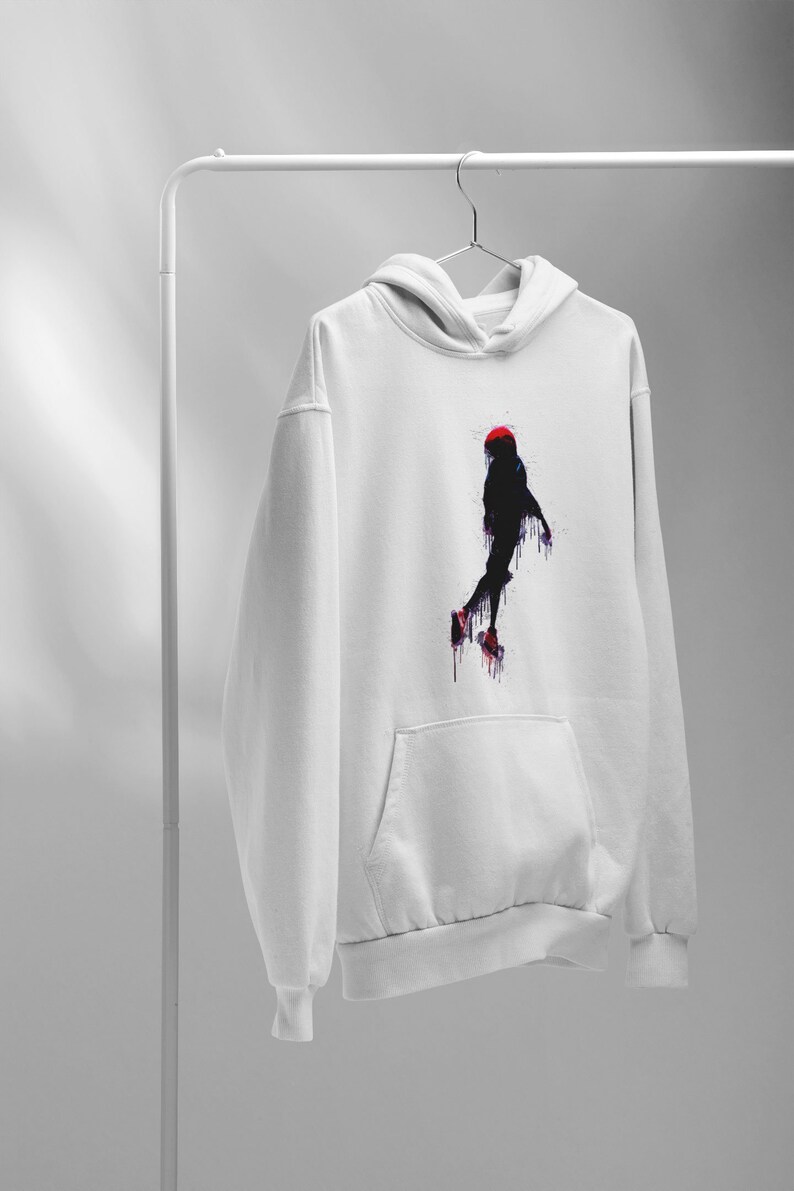 May include: White hoodie with a black and red silhouette of a person jumping in mid-air. The silhouette is painted with a dripping effect.