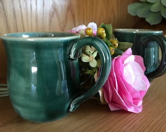 Hand made stoneware ceramic mug fully glazed in shades of forest green and blue