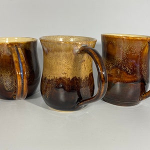 Hand made ceramic mug glazed in the colours of autumn