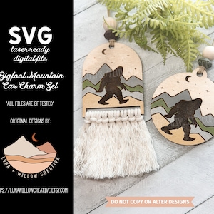 May include: Two wooden car charms featuring a Bigfoot silhouette walking through a mountain range with a crescent moon and stars. The charms are laser cut and ready to be used as a car accessory.