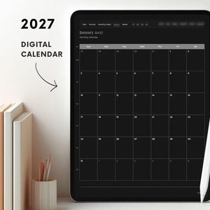 May include: A digital tablet displaying a black 2027 monthly calendar for January with a white grid layout. The text 2027 DIGITAL CALENDAR is visible to the left. A white stylus rests against the right side of the tablet screen.