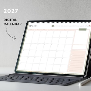 May include: A tablet displaying a 2027 digital calendar for the month of January. The screen shows a grid layout with a sidebar for notes and a checklist. Text on the screen reads 2027 DIGITAL CALENDAR and JANUARY. The tablet has a black keyboard.