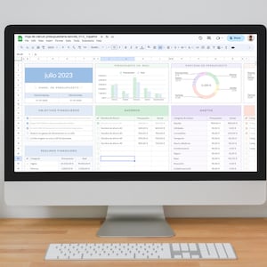 May include: A computer screen displaying a spreadsheet with a budget planner for the month of July 2023. The spreadsheet includes sections for income, expenses, savings, and financial goals. The spreadsheet also includes charts and graphs to visualize the data.