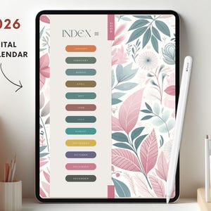 May include: A 2026 digital calendar on a tablet, featuring an index with colourful month labels. The screen displays a floral design in pink, green, and white. A white stylus is positioned on the right.