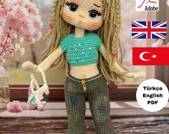May include: A handmade crochet doll with long blonde hair, blue eyes, and a turquoise top. The doll wears gray pants with colorful patches and pink shoes, holding a small purse. The doll is a PDF pattern.