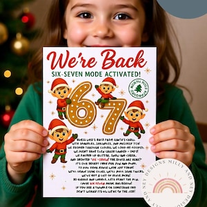 May include: A child holds a 5x7 inch Christmas-themed print. The print features the text "We're Back" and "SIX-SEVEN MODE ACTIVATED!" with gingerbread-style numbers and elf illustrations. The print has a festive design with a North Pole stamp.