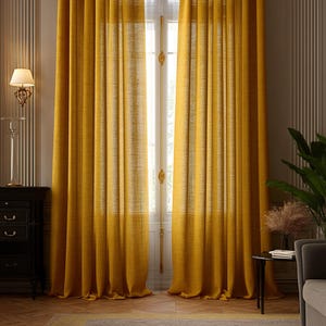 May include: A pair of floor-length mustard yellow curtains with a visible woven texture. The curtains hang in vertical folds from a rod, covering a window that allows soft light to filter through the fabric, creating a warm and bright appearance.