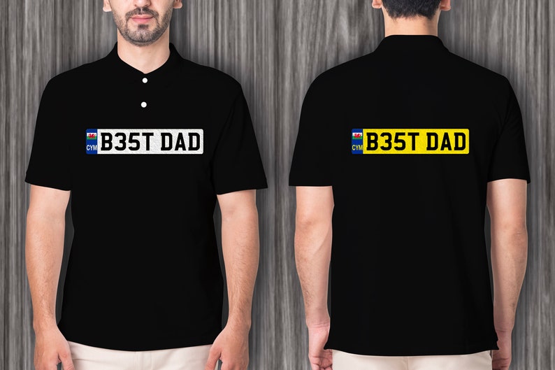 May include: Black polo shirt with a white license plate design that says "B35T DAD" with a Welsh flag on the left side of the plate.