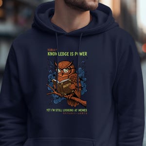 Owl wearing glasses reads a book with text about memes.