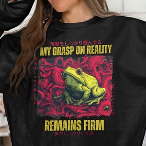 Frog Grasp on Reality Graphic Sweatshirt, Funny Frog Shirt, Quirky Frog Apparel, Bold Frog Top, Humorous Frog Graphic Pullover