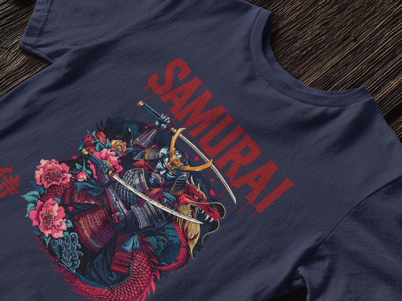May include: Navy blue t-shirt featuring a detailed illustration of a samurai warrior riding a dragon, with the word "SAMURAI" in red. The design includes swords, flowers, and Japanese characters.