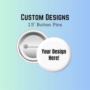 May include: Two white 3.8 cm button pins with a custom design option. One pin is open, showing the pin back. The other pin has the text "Your Design Here!" in black. The text "CUSTOM DESIGNS" is above the pins.