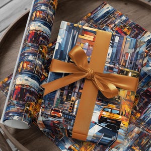 May include: A gift wrapped in blue and yellow wrapping paper with a cityscape design. The gift is tied with a brown ribbon and bow. The wrapping paper is also on a wooden table.