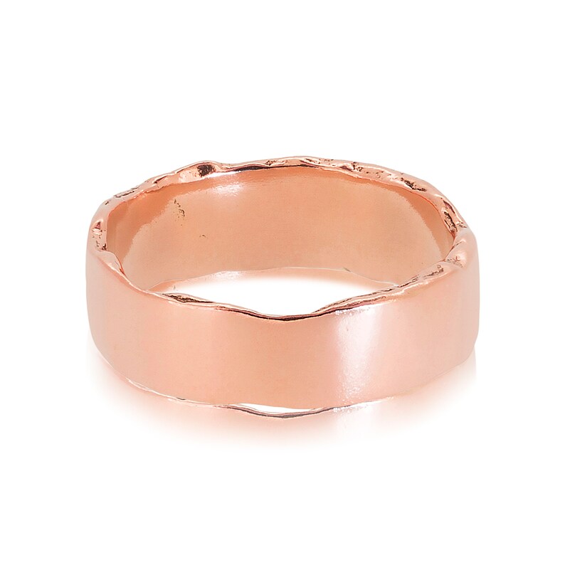 9ct rose gold Dart Wedding ring measuring 6.5mm wide by 1.4 mm deep on its side to show the smooth face and textured edge. The widest band in our collection.