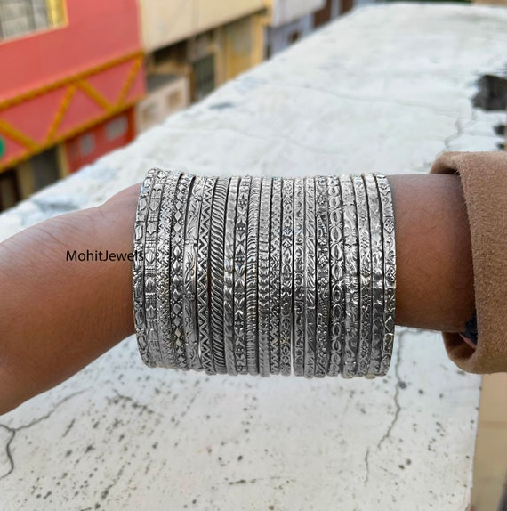 Multiple cheap silver bangles