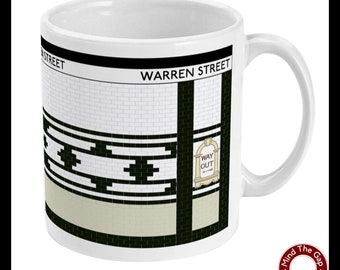 May include: White ceramic mug with a black and white graphic of a subway station entrance. The graphic includes the text "WARREN STREET" and a sign that reads "WAY OUT".