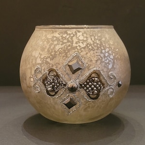 Golden Mercury glass votive holder.