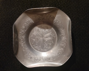 Wilson Specialties Co. Hand wrought-aluminum dish.