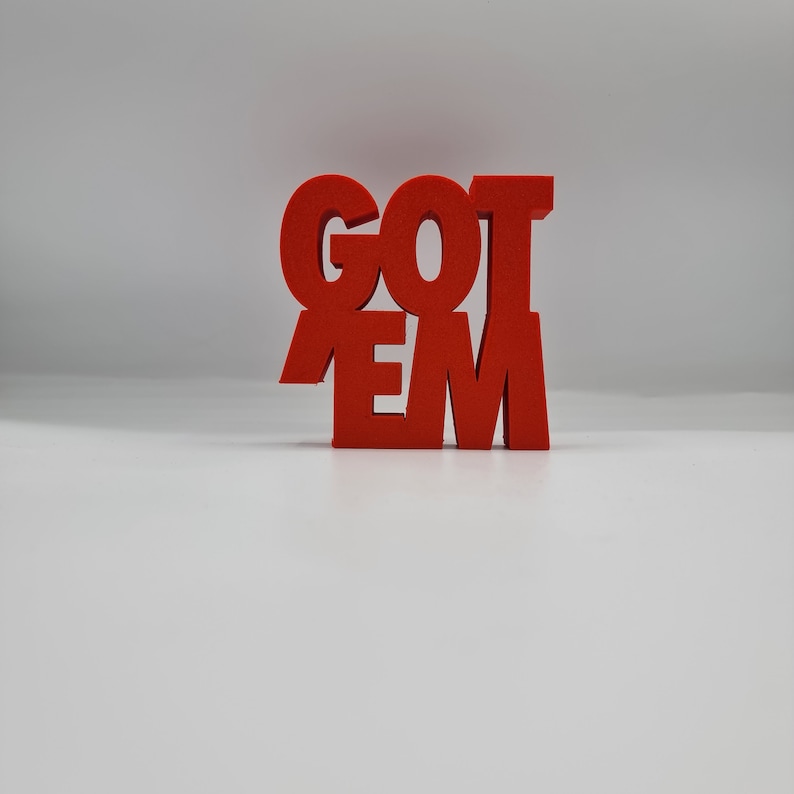May include: Red foam letters spelling out "GOT EM" in a bold, blocky font.