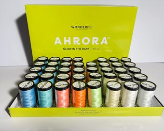 May include: A box of 50 spools of glow-in-the-dark thread. The spools are arranged in rows and are labeled "Ahurora Glow in the Dark Thread".