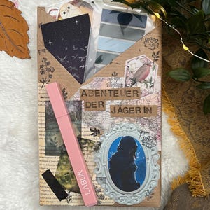 Blind Date mit einem Buch inklusive passender Goodies wie Lesezeichen, Haftnotizen, Sticker und Textmarker - ABENTEUER DER JÄGERIN