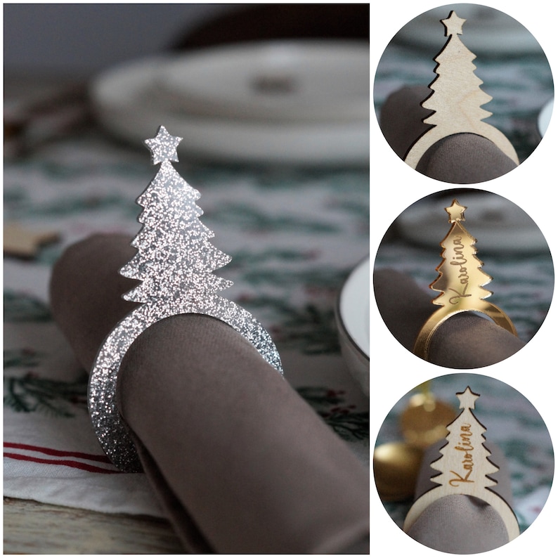 May include: Three silver and gold Christmas tree napkin rings. The silver ring is decorated with glitter. The gold rings have the name "Karolina" engraved on them.
