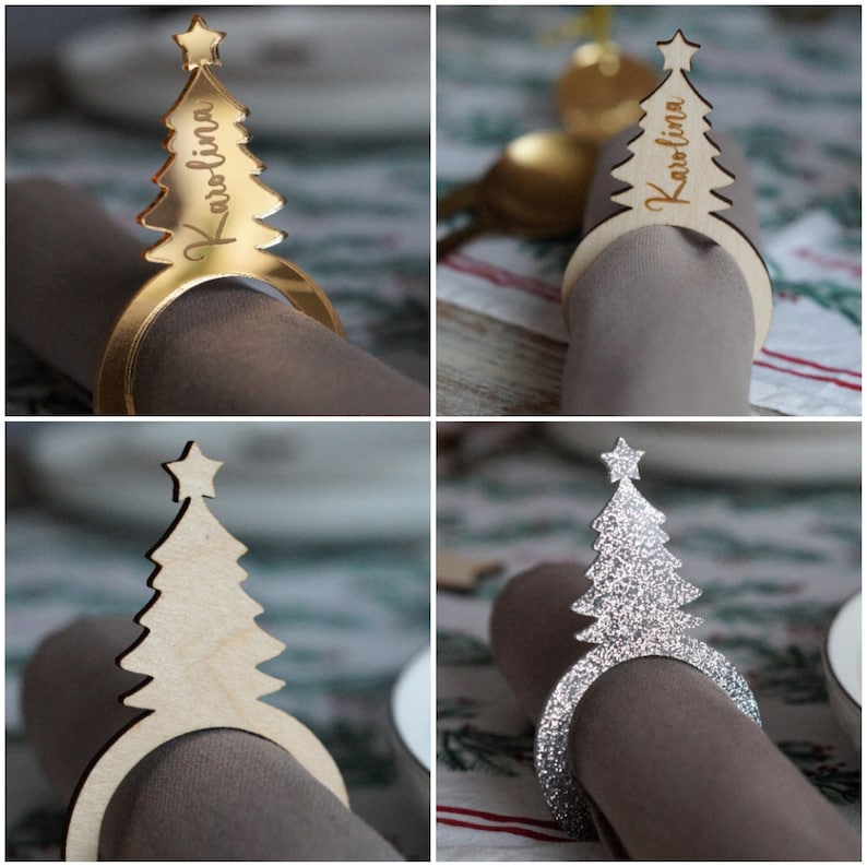May include: Four wooden Christmas tree napkin rings. Two are gold, one is natural wood, and one is silver glitter. The rings are decorated with the names "Karolina" and "Arolina".