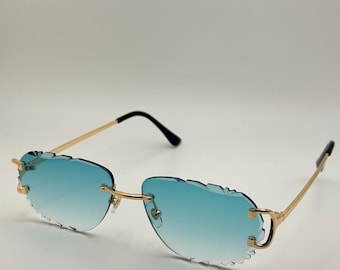 Elegante randlose Sonnenbrille mit blauem Farbverlauf, goldenem Rahmen, UV400-Schutz und individuellem Gehäuse