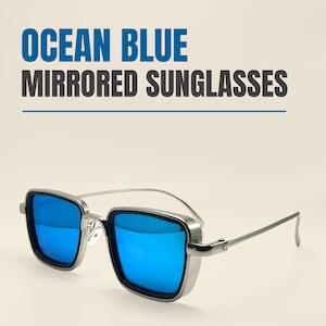 May include: Ocean blue mirrored sunglasses with a silver frame. The sunglasses have square lenses and a modern design. The text "OCEAN BLUE MIRRORED SUNGLASSES" is displayed above the sunglasses.