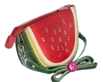 May include: A watermelon-shaped crossbody bag with a red, green, and white design. The bag features a zipper closure, a green strap, and a seed pattern. The bag is made of leather and has a unique, fun design.
