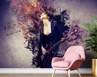 May include: A woman with long, flowing red hair plays an electric guitar against a purple and black abstract background. The background features splashes of color and smoke-like patterns.