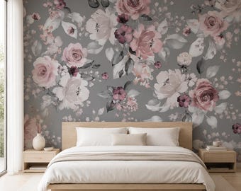 May include: A bedroom featuring a large bed with white bedding and a wooden frame, positioned against a wall covered in wallpaper with a floral pattern of pink, white, and dark red roses and leaves set against a solid gray background.