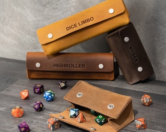 May include: A set of three brown leather dice bags with the words "Dice Limbo", "Highroller", and "*KSA*" embossed on them. The bags are open and filled with colorful dice.