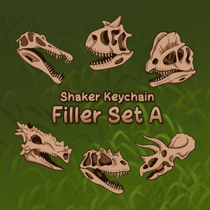 Puede incluir: Conjunto de siete llaveros con forma de cráneo de dinosaurio. Los llaveros están hechos de plástico y presentan una variedad de cráneos de dinosaurios, incluyendo un T-Rex, un Triceratops y un Stegosaurus. Los llaveros son todos de color marrón claro y tienen un efecto de agitador.