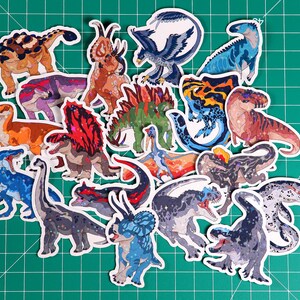 May include: A collection of colorful dinosaur stickers featuring various species, including a T-Rex, Triceratops, Stegosaurus, and Pterodactyl. The stickers are perfect for adding a prehistoric touch to any project.