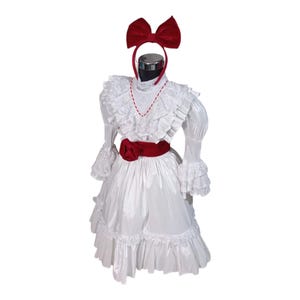 Turn your little girl into the terrifying Annabelle! Complete horror costume with dress, red bow and headband for a spooky look.