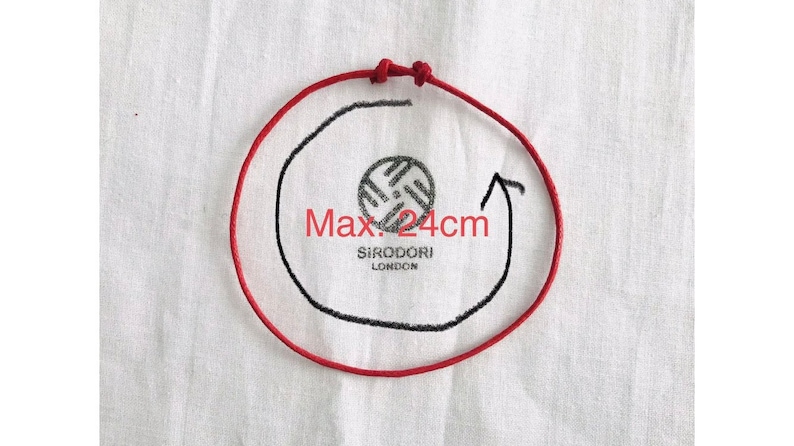 May include: A red cord forms a circle with a black outline and arrow, indicating a maximum diameter of 24cm. The text "Max. 24cm" is visible. The center features a circular logo with the text "SIRODORI LONDON".