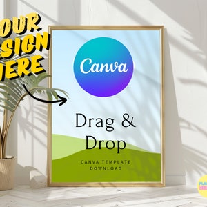 May include: A gold framed poster with a blue and purple gradient circle with the word "Canva" in white text. The poster has a green and white landscape background with the text "Drag & Drop" in black text and "CANVA TEMPLATE DOWNLOAD" in smaller black text.