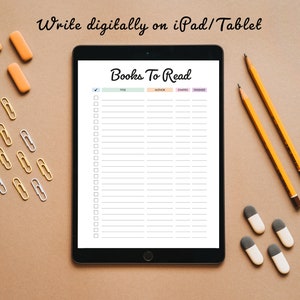 May include: A digital tablet with a white background and the text "Books To Read" at the top. The tablet is on a brown surface with yellow pencils, orange erasers, and gold and silver paper clips.