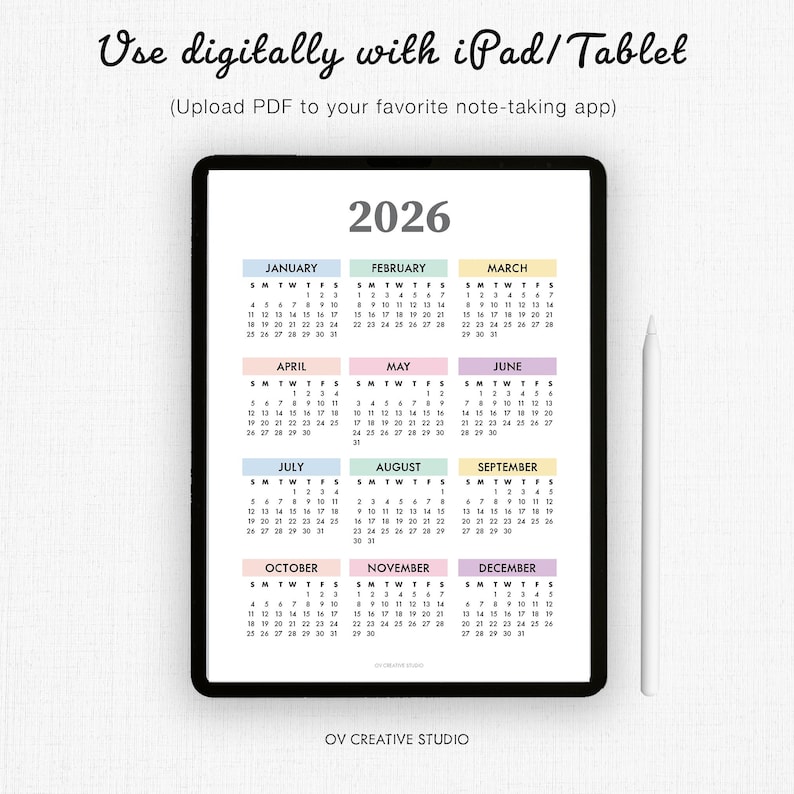 May include: A digital 2026 calendar displayed on a black tablet. The calendar is organized by month, with each month in a different pastel color. The text "Use digitally with iPad/Tablet" is at the top.