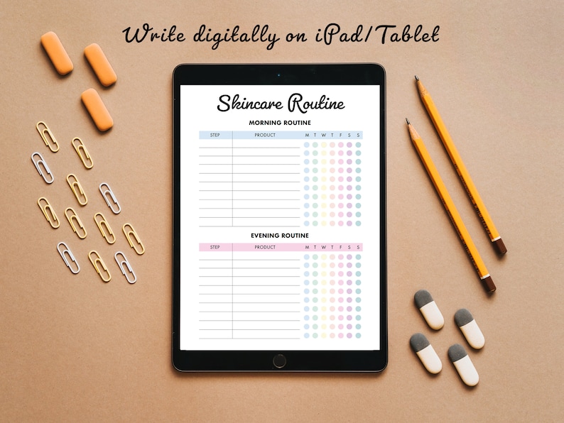 May include: A black iPad displaying a skincare routine template with sections for morning and evening routines. The text "Write digitally on iPad/Tablet" is at the top. Pencils, erasers, and paper clips are scattered around the iPad on a brown surface.