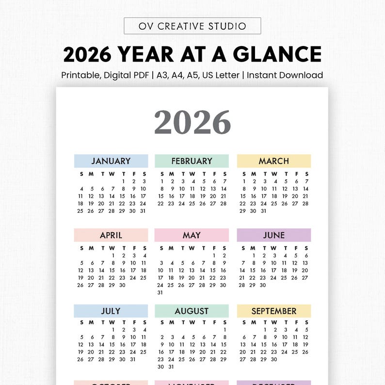 May include: A 2026 year-at-a-glance calendar with a clean, minimalist design. The calendar features monthly layouts with each month in a different pastel color. The text "2026" is prominently displayed at the top.