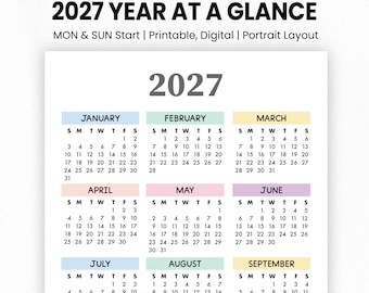 May include: A 2027 year at a glance calendar featuring a portrait layout with months organized in colorful blocks. The text reads OV CREATIVE STUDIO, 2027 YEAR AT A GLANCE, MON & SUN Start, Printable, Digital, Portrait Layout, and A3, A4, A5, US Letter, Instant Download.