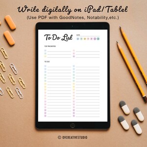 May include: A digital to-do list template on a tablet screen. The template has a colorful design with pastel colors and a section for top priorities and a to-do list. The tablet is on a brown surface with pencils, erasers, and paper clips.