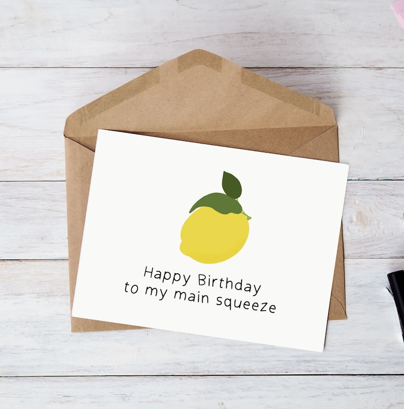 May include: A white card with a yellow lemon illustration and the text "Happy Birthday to my main squeeze".