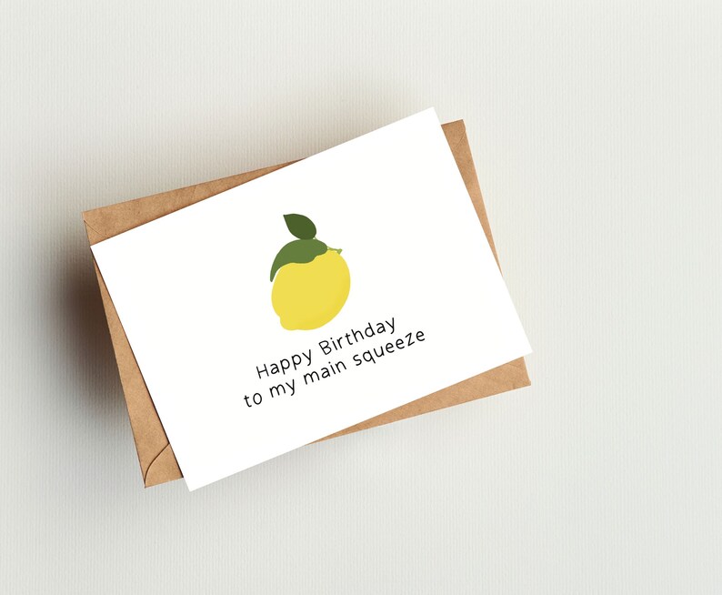 May include: A white card with a yellow lemon illustration and the text "Happy Birthday to my main squeeze".