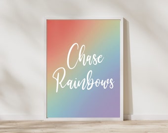 May include: A white framed print with a rainbow gradient background and the text "Chase Rainbows" in white.