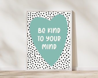 May include: A white framed print with a black and white polka dot background. A teal heart shape with the text "Be kind to your mind" is in the center of the print.