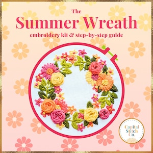 May include: Embroidery kit for a floral wreath with the text "The Summer Wreath" and "embroidery kit & step-by-step guide". The wreath is made of pink, yellow, and orange flowers and green leaves. The kit is from Capital Stitch Co.