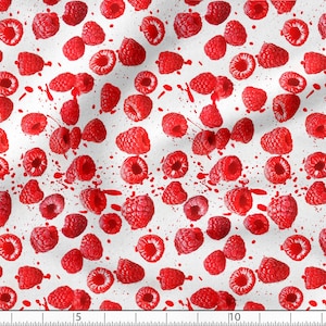 May include: White fabric with a repeating pattern of red raspberries and red splatters of paint.